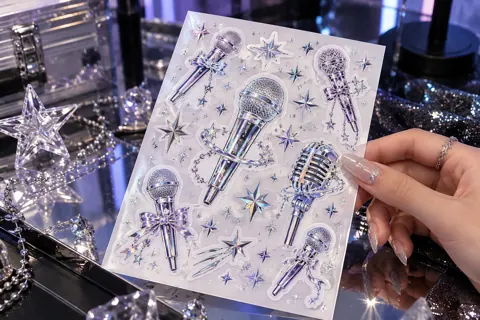Custom sticker sheets with original kpop-inspired artwork: holographic microphone and silver star typography-free art